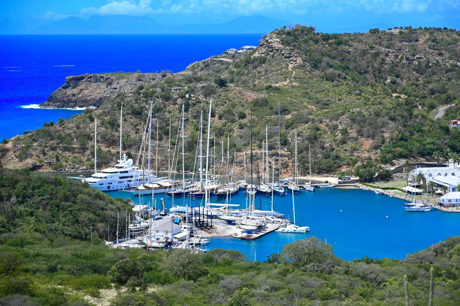 A turquoise Caribbean bay with boats at anchor in Antigua.